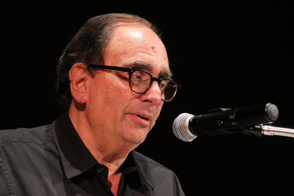 R.L. Stine speaks at the University Auditorium on Tuesday. More than 700 people came to hear Stine share his stories and answer audience questions.