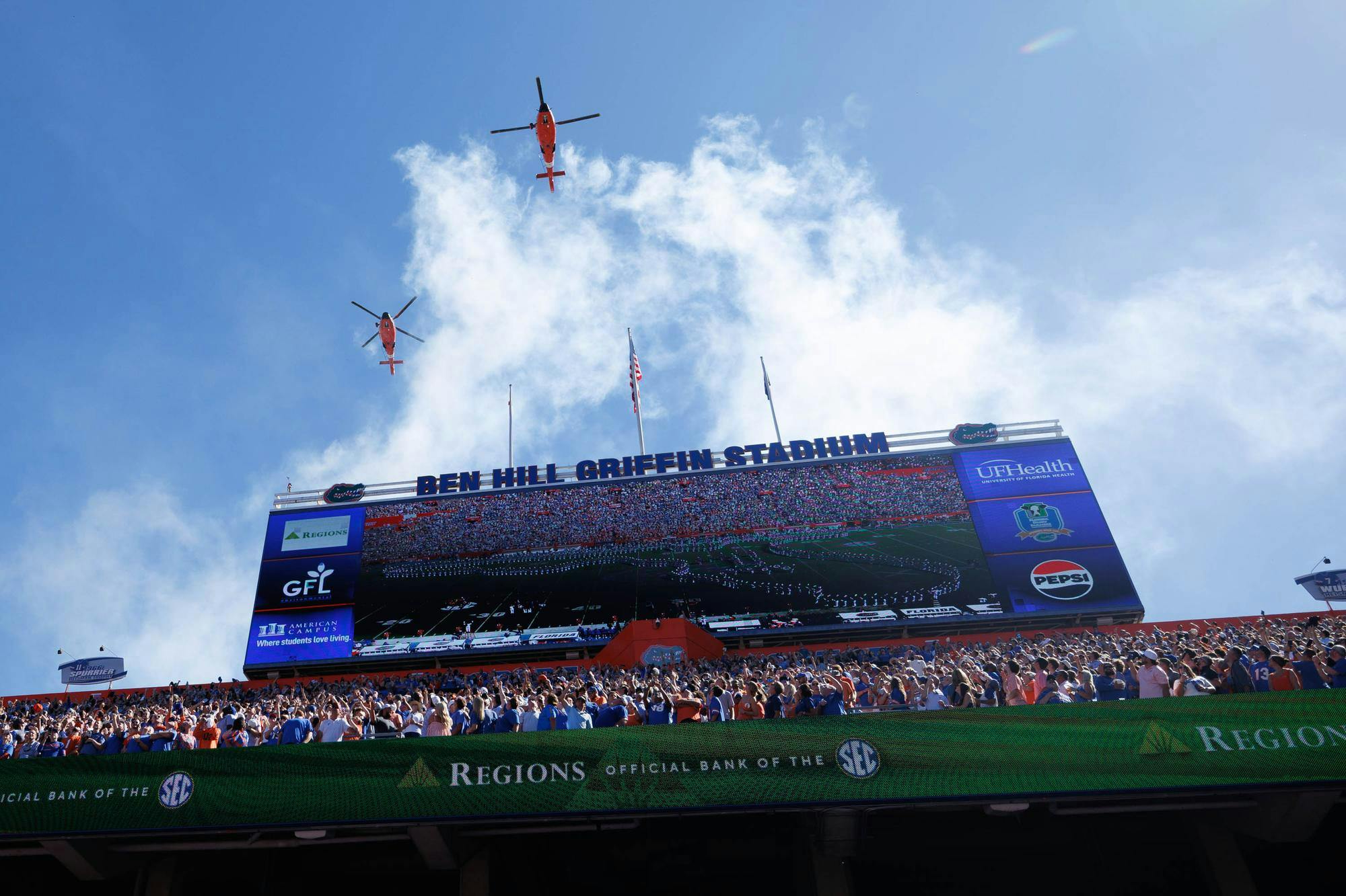 Helicopters fly over Ben Hill Griffin Stadium during the first half of an NCAA college football game against Ole Miss, Saturday, Sept. 26, 2026, in Gainesville, Fla.
