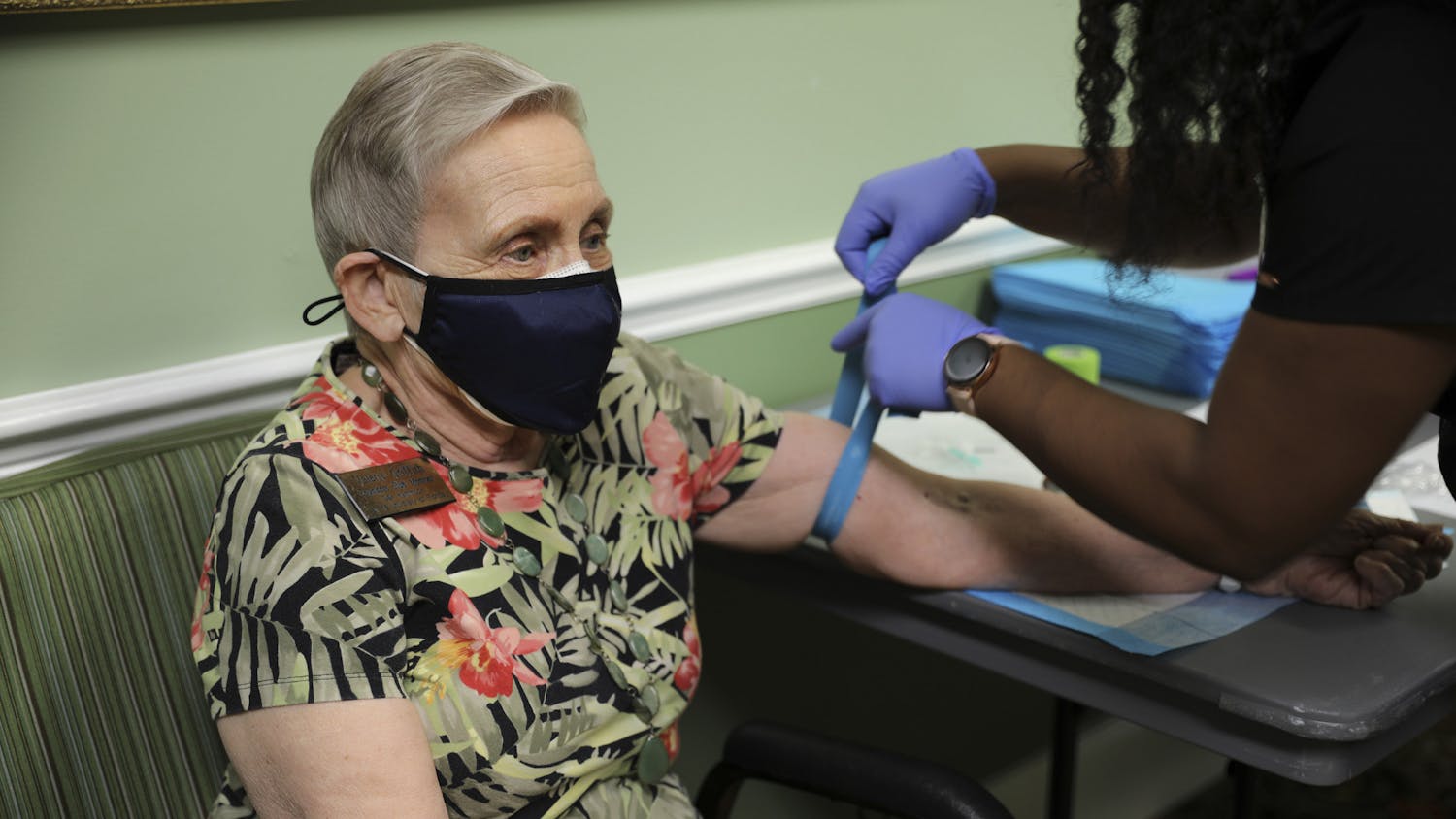 Valerie Griffith, a Founders Club member of Oak Hammock at the University of Florida, participates in the CITRUS Study as a nurse puts a tourniquet on her arm on Wednesday, June 9, 2021.