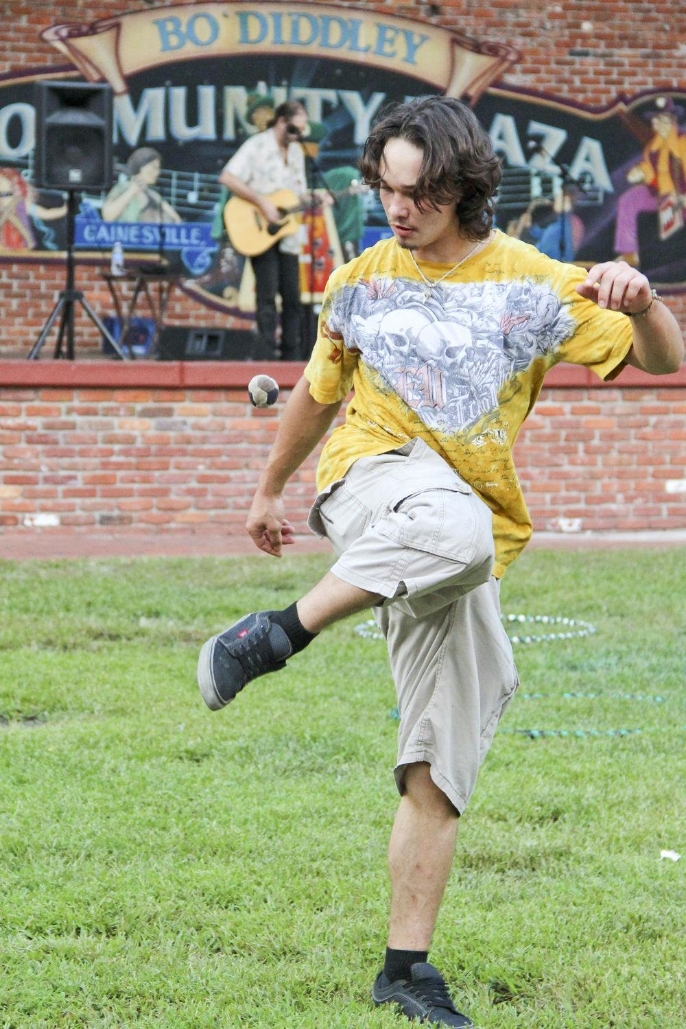 SIATech Gainesville senior Skylar Chavez plays hacky sack on Bo Diddley Community Plaza on Wednesday afternoon.