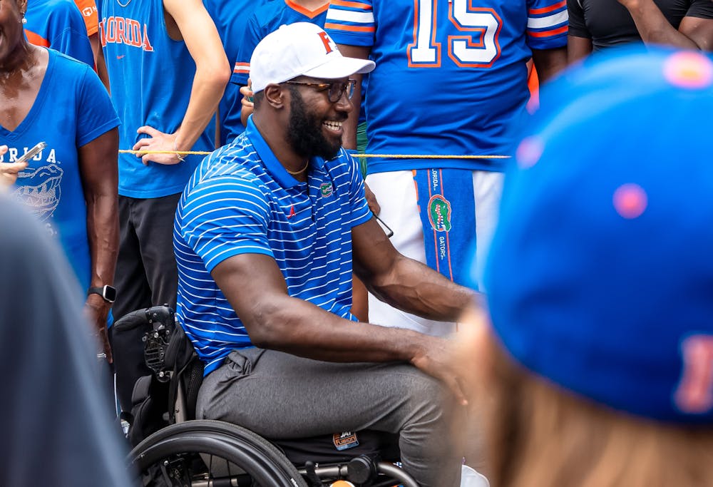 <p>Former Gator basketball player Patric Young participates in Gator Walk during Championship Reunion Weekend on Saturday, Sept. 14, 2024.</p>