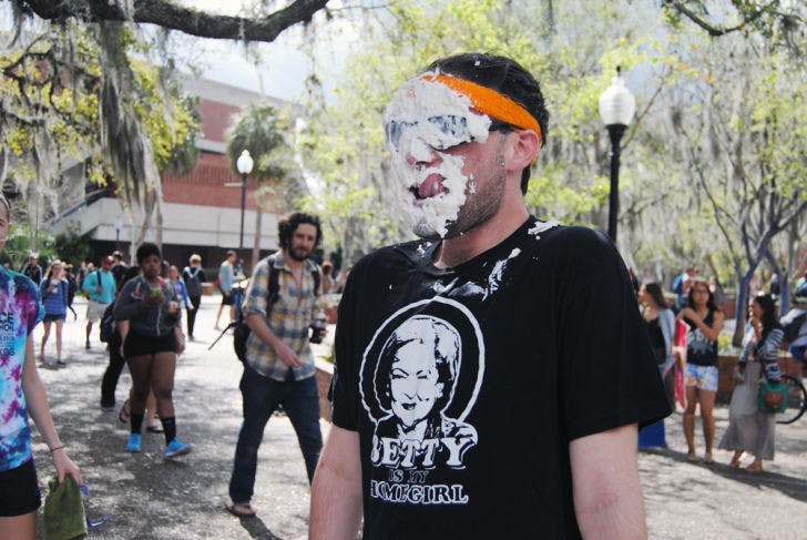 Cody Lasso, a 20-year-old UF telecommunication sophomore, volunteers to have pies thrown in his face to raise money for Phi Sigma Pi’s Dance Marathon team.
