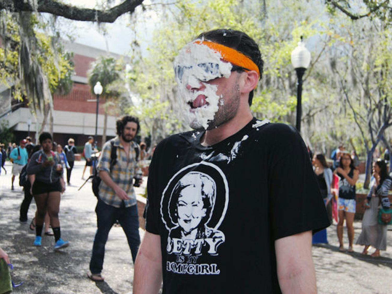 Cody Lasso, a 20-year-old UF telecommunication sophomore, volunteers to have pies thrown in his face to raise money for Phi Sigma Pi’s Dance Marathon team.
