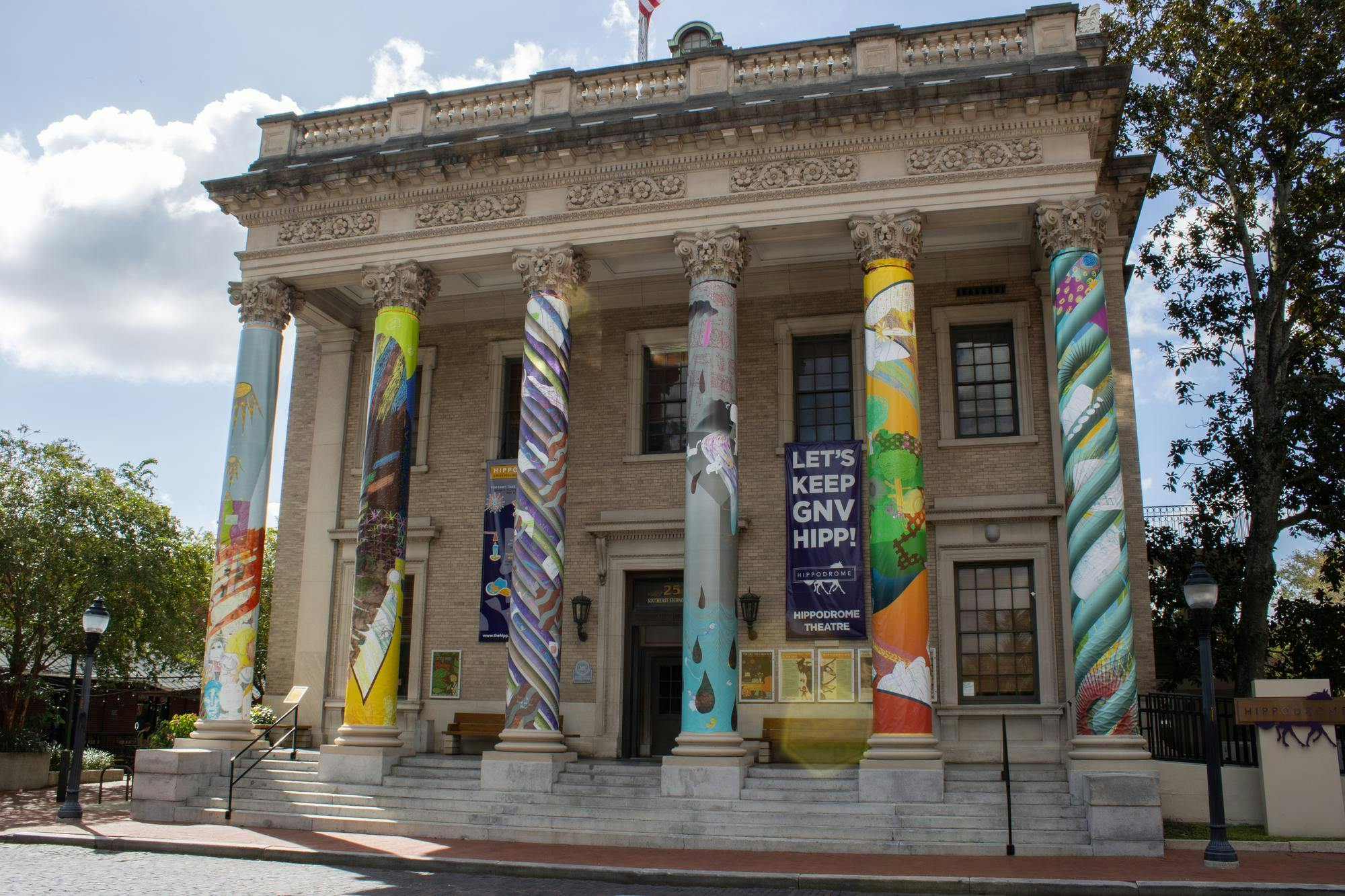 Art exhibit "a river full of all my lost loved ones" displayed on the columns of the Hippodrome Theatre, Wednesday, Sept. 16, 2026, in Gainesville, Fla.