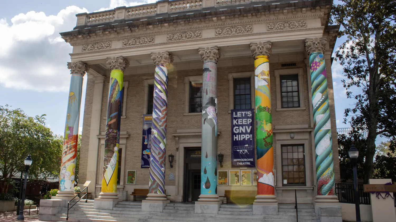 Art exhibit "a river full of all my lost loved ones" displayed on the columns of the Hippodrome Theatre, Wednesday, Sept. 16, 2026, in Gainesville, Fla.