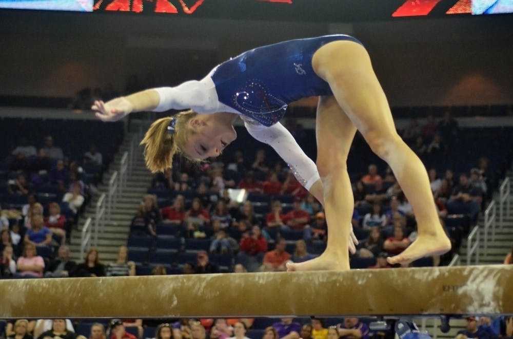 <p>Alex McMurtry falls off the balance beam during the Southeastern Conference Championships on March 21 at the Arena at Gwinnett Center in Duluth, Georgia. McMurtry scored a 9.30 on the event.</p>