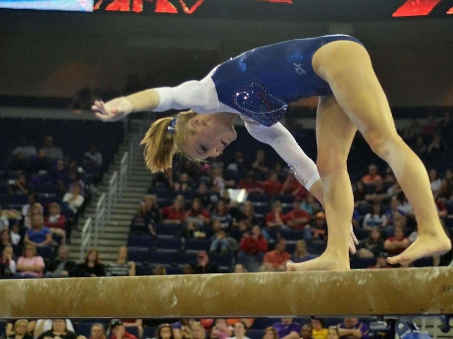 Alex McMurtry falls off the balance beam during the Southeastern Conference Championships on March 21 at the Arena at Gwinnett Center in Duluth, Georgia. McMurtry scored a 9.30 on the event.