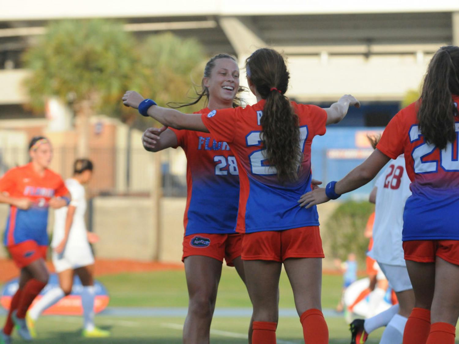 UF midfielders Meggie Dougherty Howard (28) and Mayra Pelayo celebrate after Pelayo scores the first goal in Florida's 5-2 win against Iowa State on Aug. 19, 2016, at James G. Pressly Stadium.