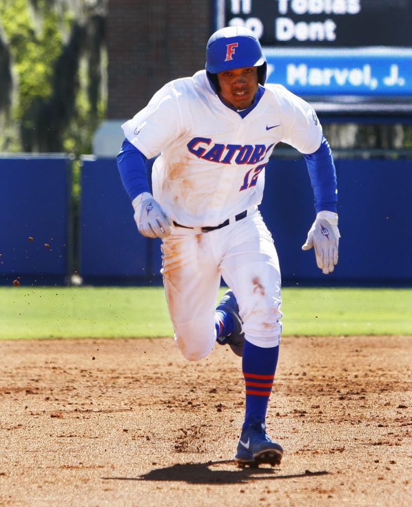 Freshman shortstop Richie Martin attempts to steal third base during Florida’s 16-5 win against Duke on Sunday at McKethan Stadium. Martin left Florida's 6-3 series-clinching win against Miami on Sunday after beating hit by a pitch in the hand. 
