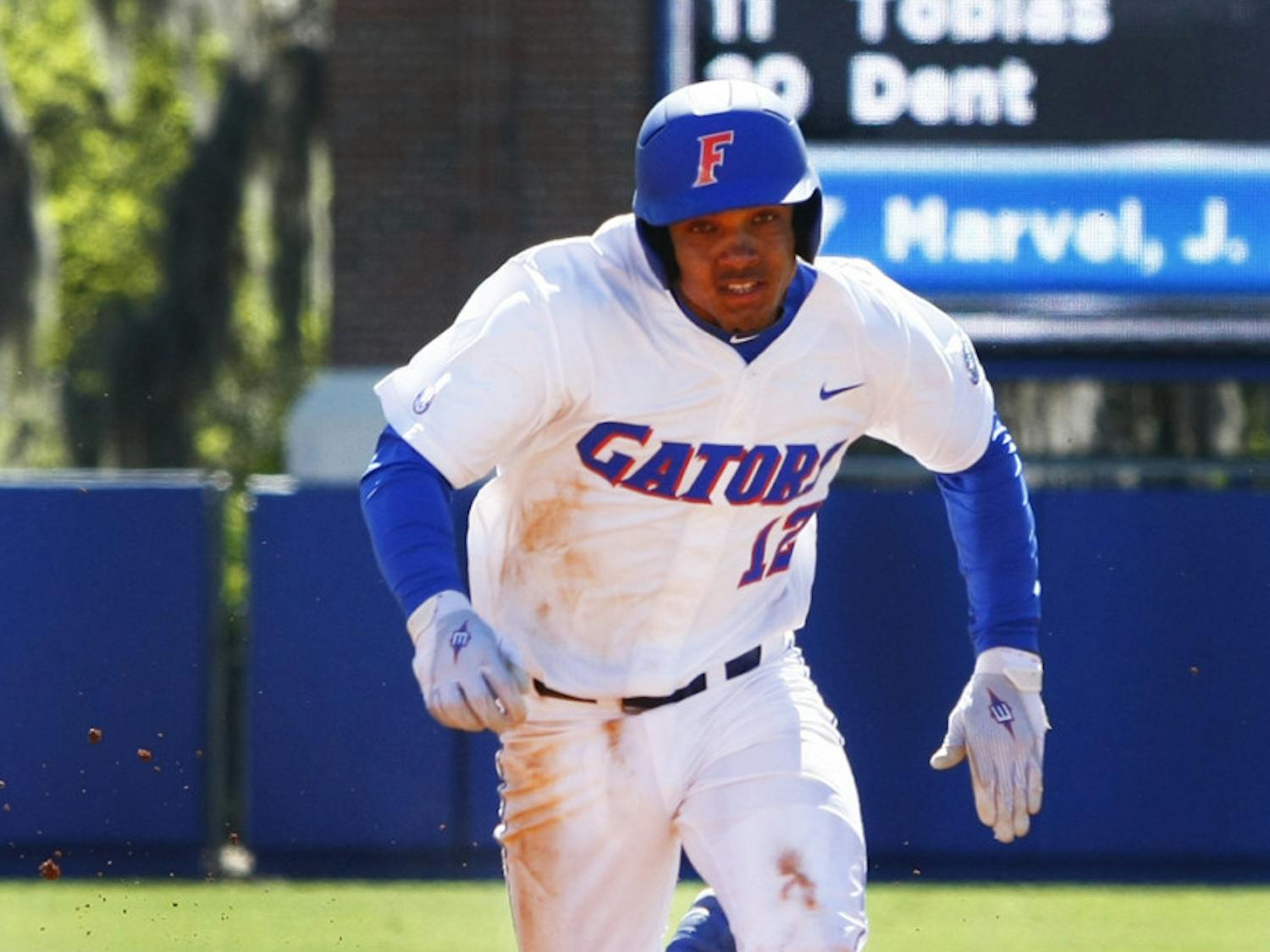 Freshman shortstop Richie Martin attempts to steal third base during Florida’s 16-5 win against Duke on Sunday at McKethan Stadium. Martin left Florida's 6-3 series-clinching win against Miami on Sunday after beating hit by a pitch in the hand.