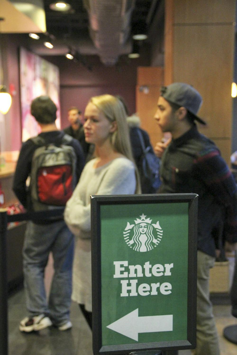 <p class="p1"><span class="s1">Hanna Smith (left), a 20-year-old UF philosophy sophomore, stands in the line at the Starbucks in Library West on Monday afternoon. Smith said she was studying for her agricultural ecology final. “I was falling asleep up there, so I thought it was time for a Starbucks run.”</span></p>