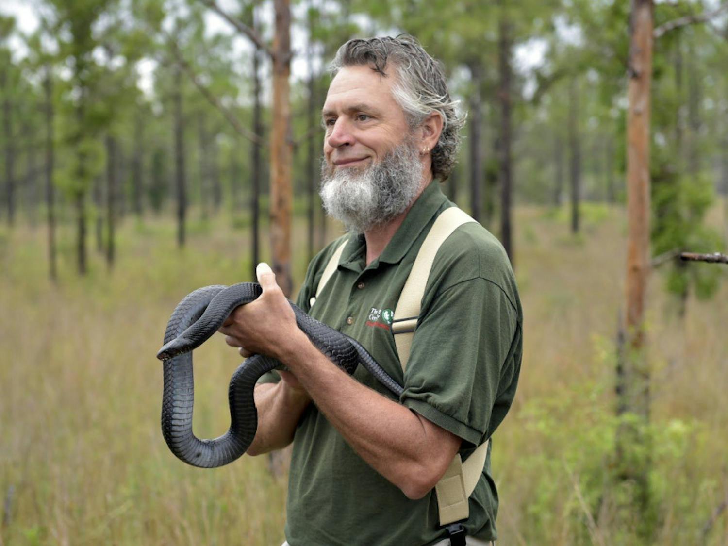 David Printiss holds an eastern indigo at the release.