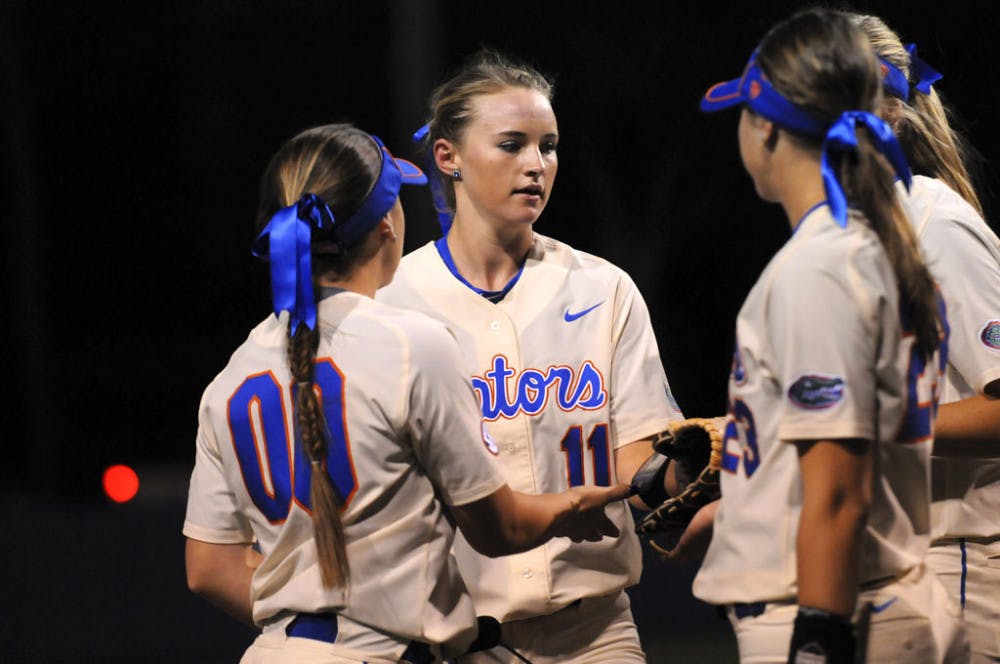 <p>Kelly Barnhill (center) celebrates with teammates during Florida's doubleheader sweep against Jacksonville on Feb. 17, 2016, at Katie Seashole Pressly Stadium.</p>