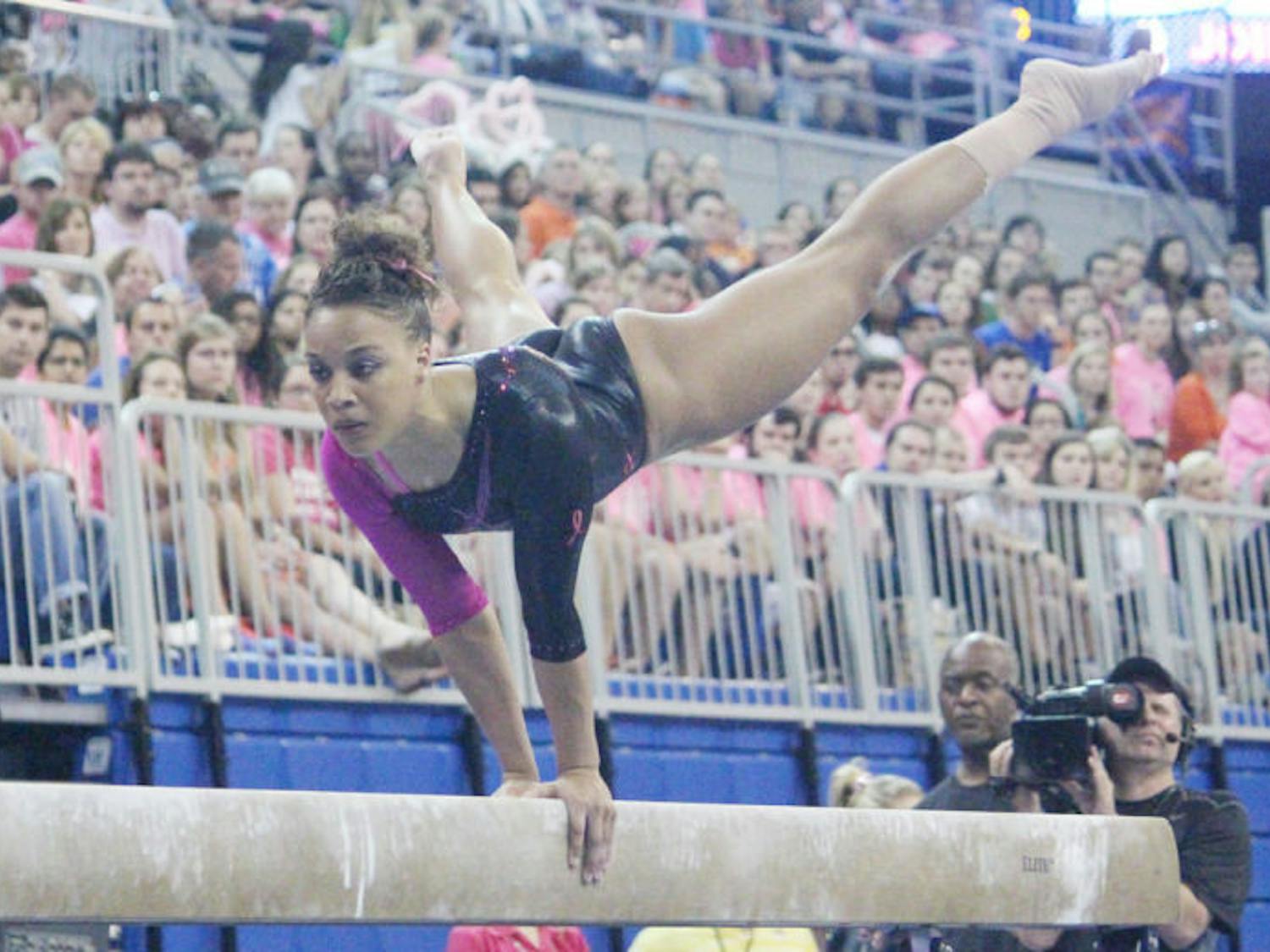 Kytra Hunter performs a balance beam routine during Florida’s 198.125-197.625 over LSU on Feb. 21. Hunter won the balance-beam title at the Southeastern Conference Championships, but the Gators finished in second — behind the Crimson Tide.