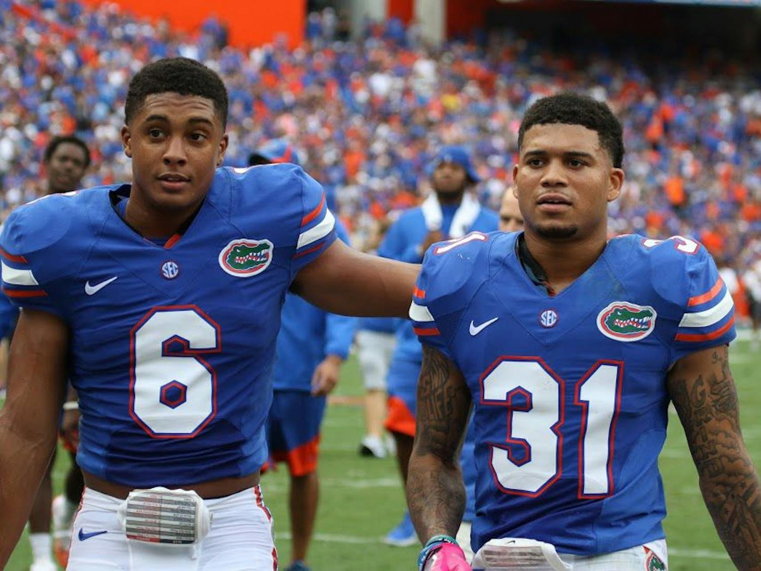UF cornerbacks Jalen Tabor and Quincy Wilson (left) walk off the field following Florida's 40-14 win against Missouri on Oct. 15, 2016, at Ben Hill Griffin Stadium.