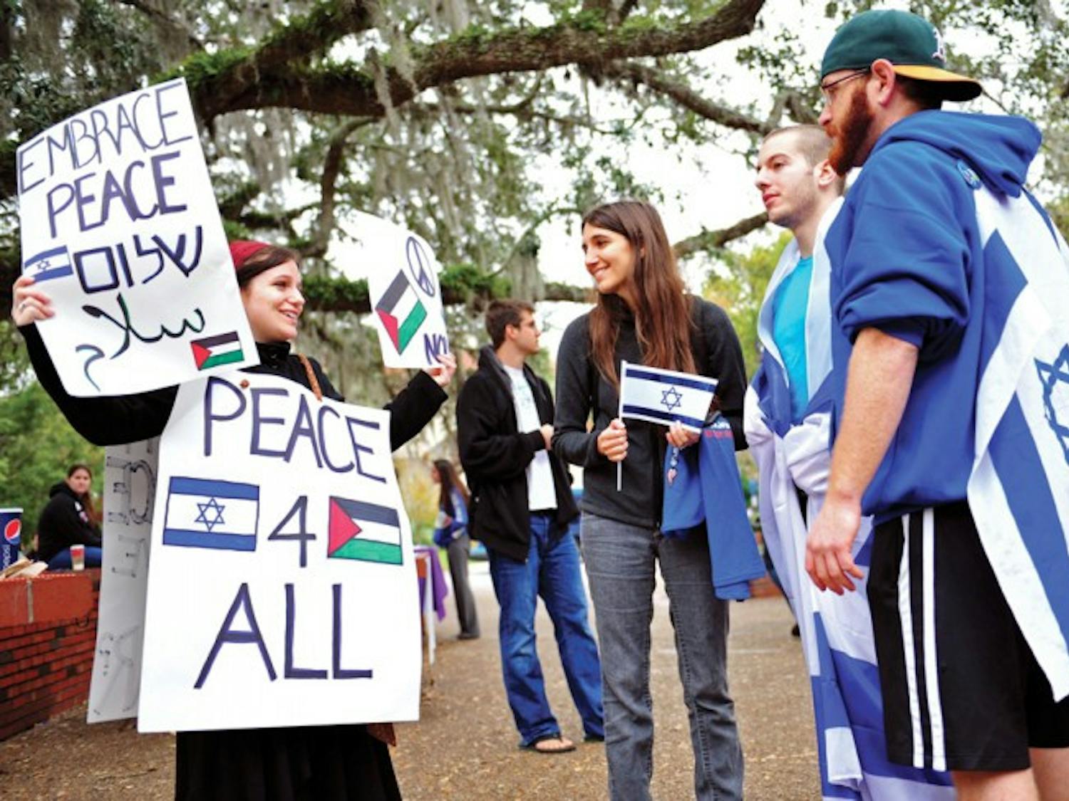 Jewish studies and political science student Jaimie Krass, 21, came independently to Turlington Plaza Thursday to promote peace during a rally split between support of Israel and Palestine. "Both sides are so preoccupied with pointing fingers," Krass said. "We've forgotten to come together for a common goal: peace."
