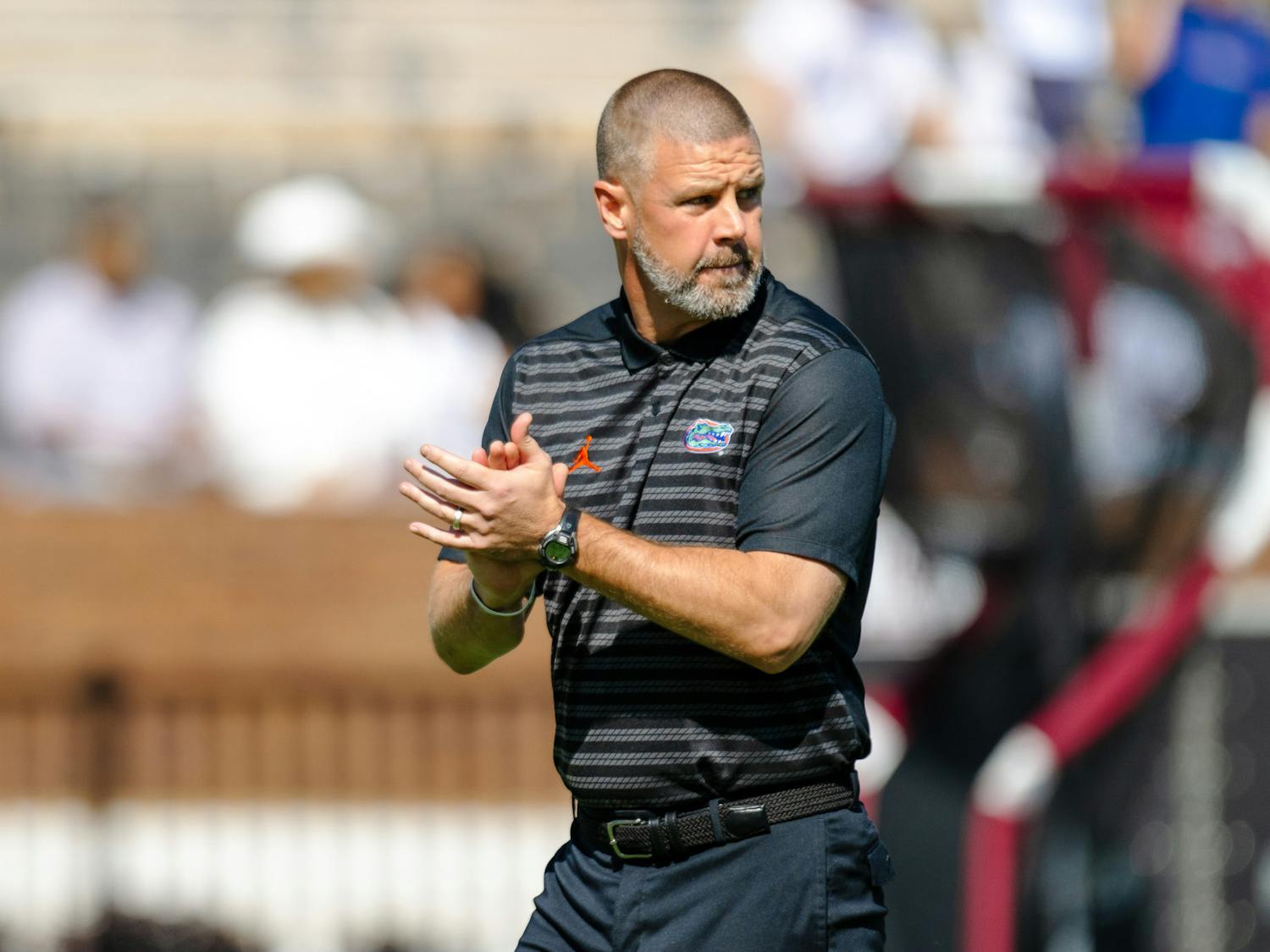 Florida Gators Football Head Coach Billy Napier watches his team practice ahead of their game against Mississippi State in Starkville, Mississippi, on Sept. 21, 2024.