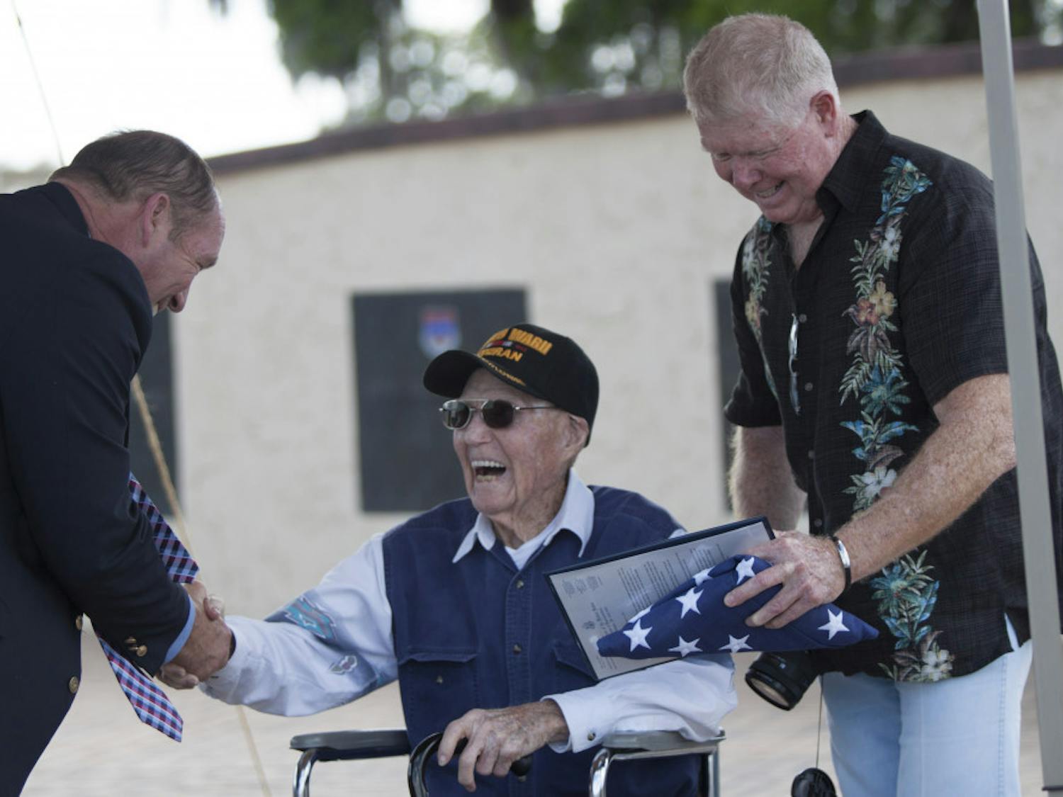 Charles D. Moloney, a 95-year-old World War II veteran, shakes the hand of Rep. Ted Yoho during a ceremony honoring Moloney's service during WWII at Camp Blanding Joint Training Center on Friday. Moloney enlisted in the U.S. Army on April 4,1942, and received six medals on Friday that he hadn't received after leaving the U.S. Army.
