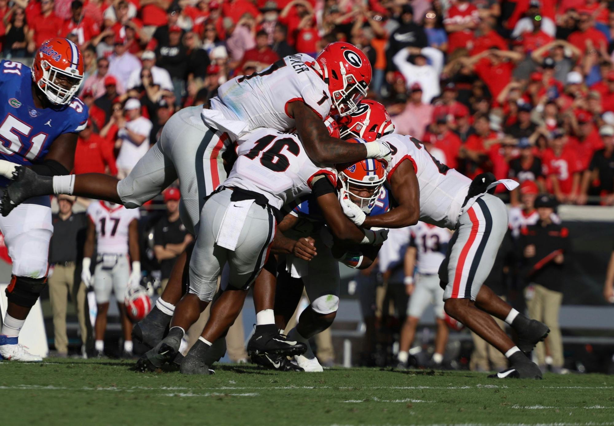 Georgia defenders swarm Florida quarterback Anthony Richardson during the first half of the Gators' 34-7 loss to Georgia on Oct. 30, 2021.
