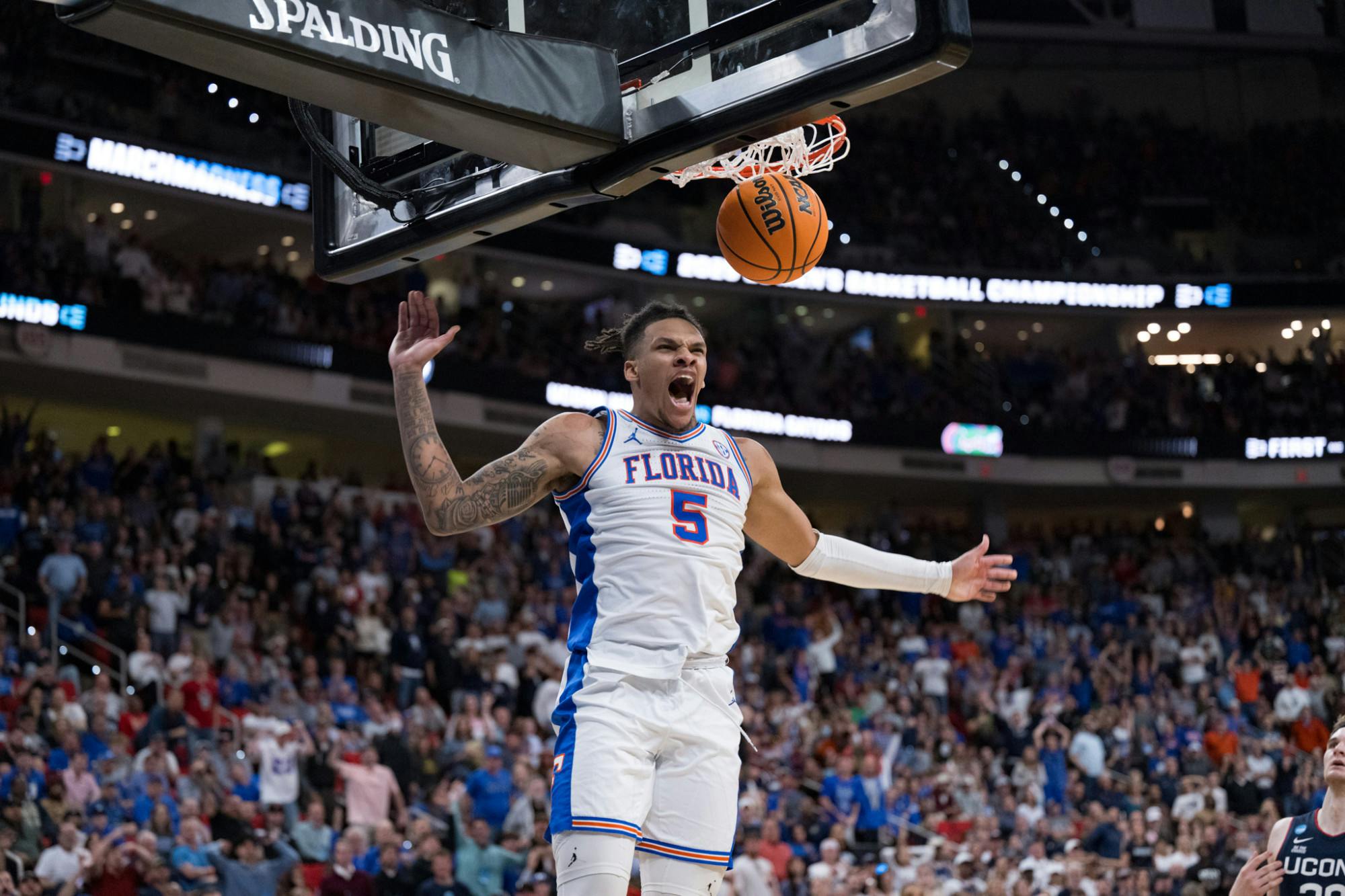Florida Gators guard Will Richard (5) dunks the ball during a basketball game against UConn in the second round of the NCAA Tournament on Sunday, March 23, 2025, in Raleigh, N.C.