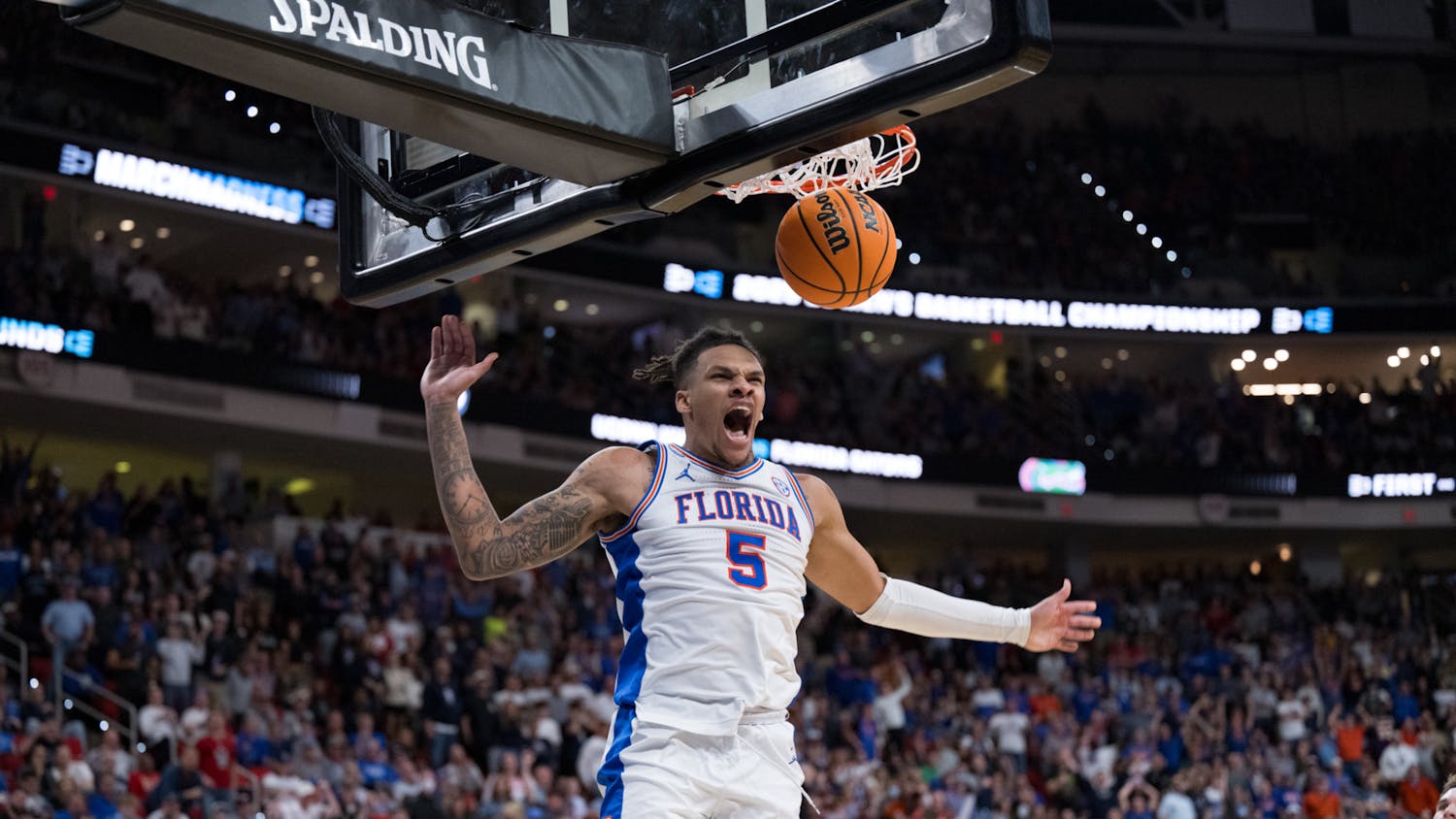 Florida Gators guard Will Richard (5) dunks the ball during a basketball game against UConn in the second round of the NCAA Tournament on Sunday, March 23, 2025, in Raleigh, N.C.