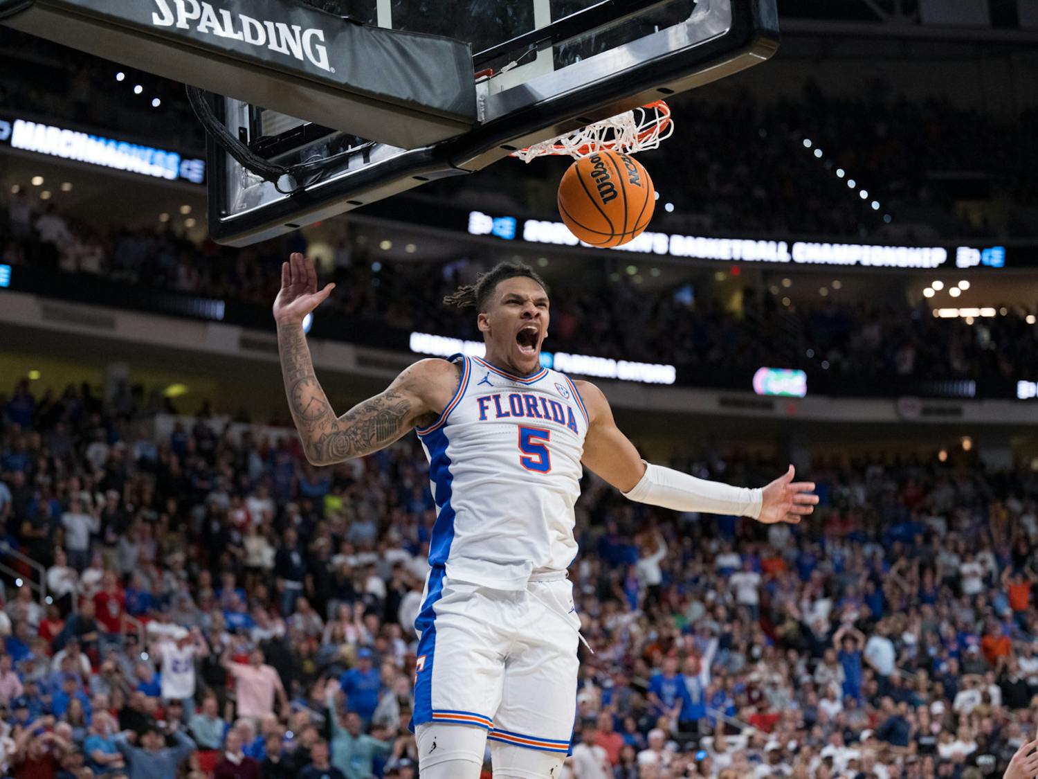 Florida Gators guard Will Richard (5) dunks the ball during a basketball game against UConn in the second round of the NCAA Tournament on Sunday, March 23, 2025, in Raleigh, N.C.