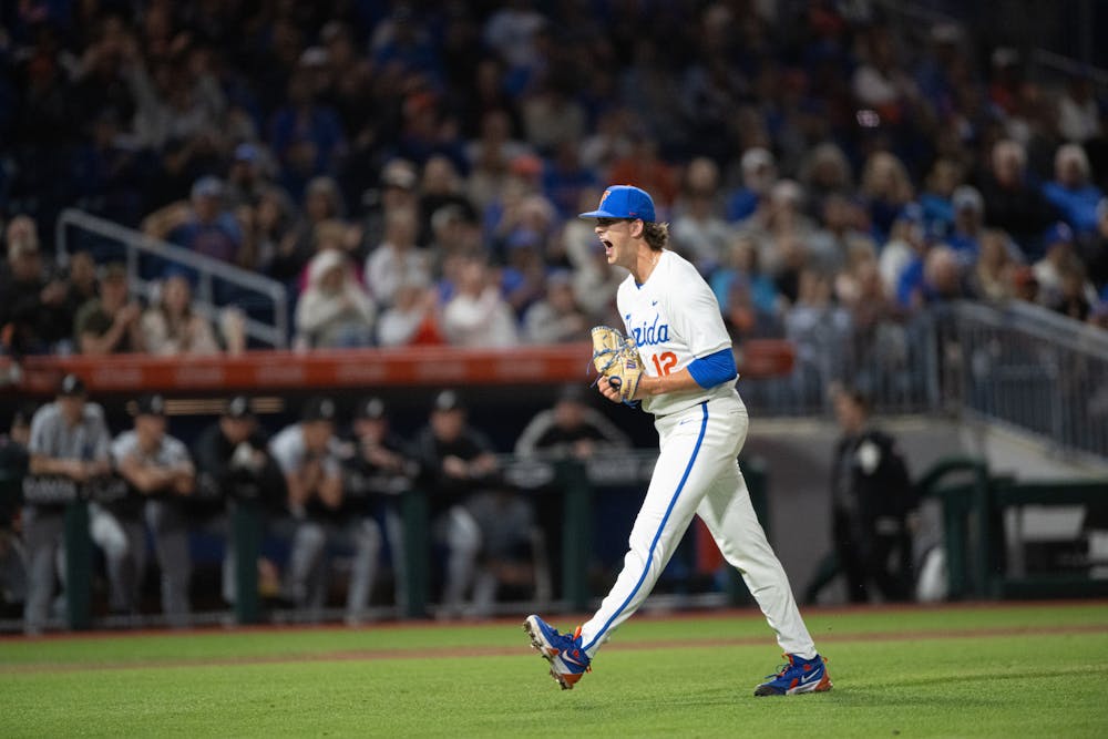 Florida Gators pitcher Liam Peterson (12) celebrates after shutting down a batter to close an inning in a baseball game against the Air Force Academy in Gainesville, Fla., on Friday, Feb. 14, 2025.