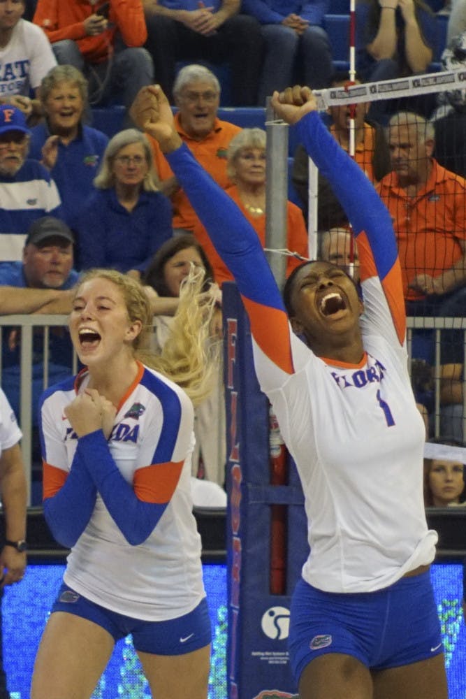 UF's Carli Snyder (left) and Rhamat Alhassan celebrate during Florida's 3-0 win against New Hampshire Dec. 3, 2015, in the O'Connell Center.