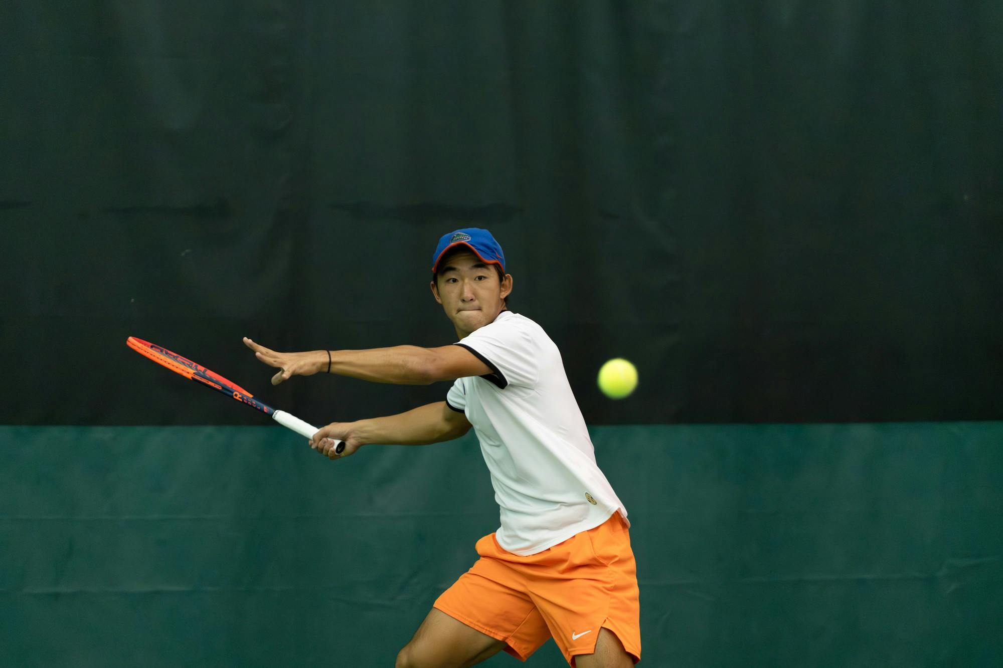 Gators men's tennis freshman Jeremy Jin goes to return the ball in the team's win over Ole Miss on Friday, March 22, 2024. 