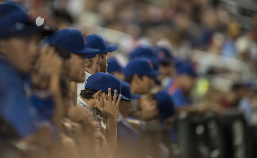 <p>Florida players watch from the dugout during the Gators' 1-0 loss against Virginia in the NCAA Men's College World Series on Monday, June 15, 2015 at TD Ameritrade Park in Omaha.</p>