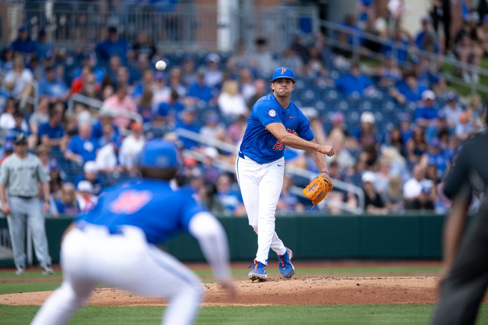 Florida Gators pitcher Jake Clemente (20) throws to pick off a runner at first in a baseball game against the Air Force Academy in Gainesville, Fla., on Friday, Feb. 15, 2025.