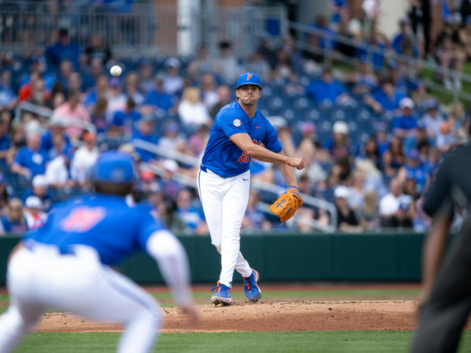 Florida Gators pitcher Jake Clemente (20) throws to pick off a runner at first in a baseball game against the Air Force Academy in Gainesville, Fla., on Friday, Feb. 15, 2025.
