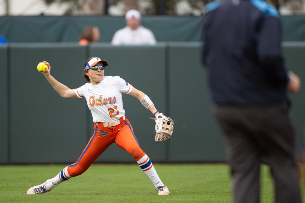 Florida Gators outfielder Kendra Falby (27) throws the ball in a softball game against Providence in Gainesville, Fla., on Friday, Feb. 14, 2025.