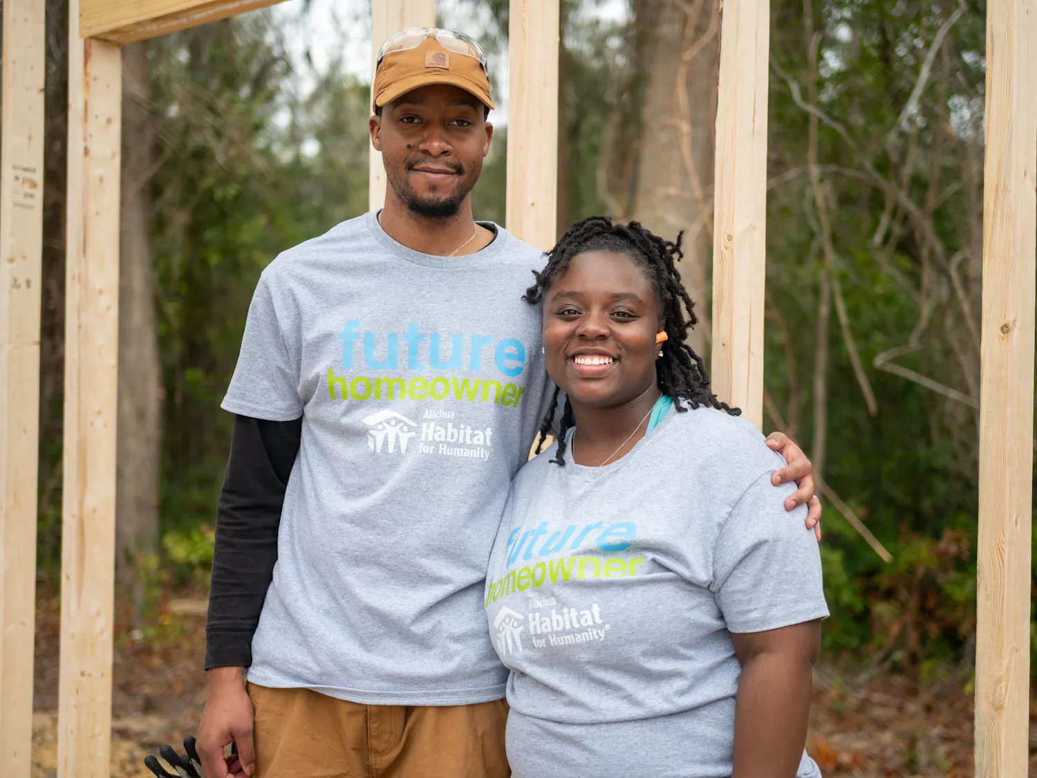 Xavier and Tameria Filer pose together in front of what will soon be their new home, Saturday, Feb. 28, 2026, in High Springs, Fla.