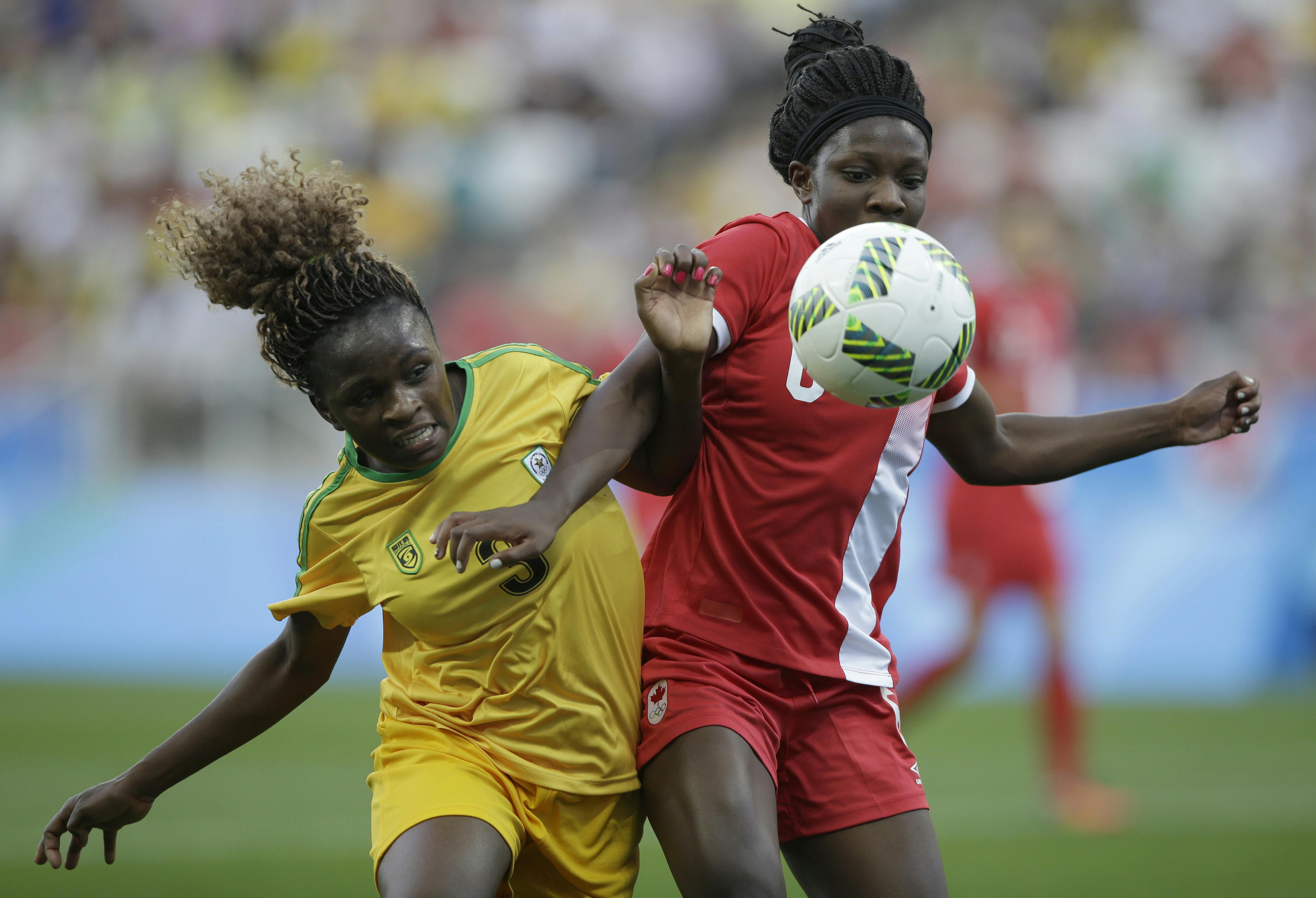 Canada's Deanne Rose, right, and Zimbabwe's Sheila Makoto fight for the ball during a group F match of the women's Olympic football tournament between Canada and Zimbabwe in Sao Paulo, Brazil, Saturday, Aug. 6, 2016. (AP Photo/Nelson Antoine)