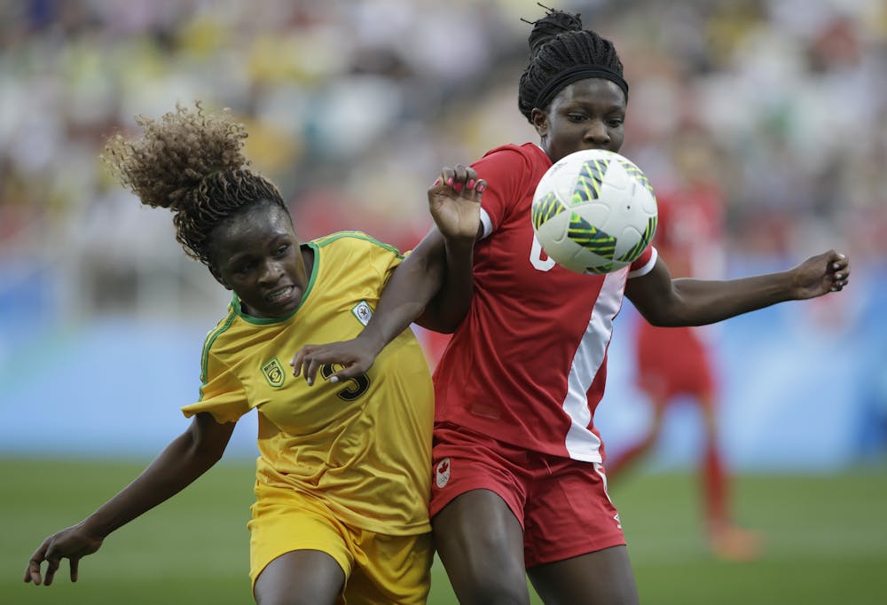 <p>Canada's Deanne Rose, right, and Zimbabwe's Sheila Makoto fight for the ball during a group F match of the women's Olympic football tournament between Canada and Zimbabwe in Sao Paulo, Brazil, Saturday, Aug. 6, 2016. (AP Photo/Nelson Antoine)</p>