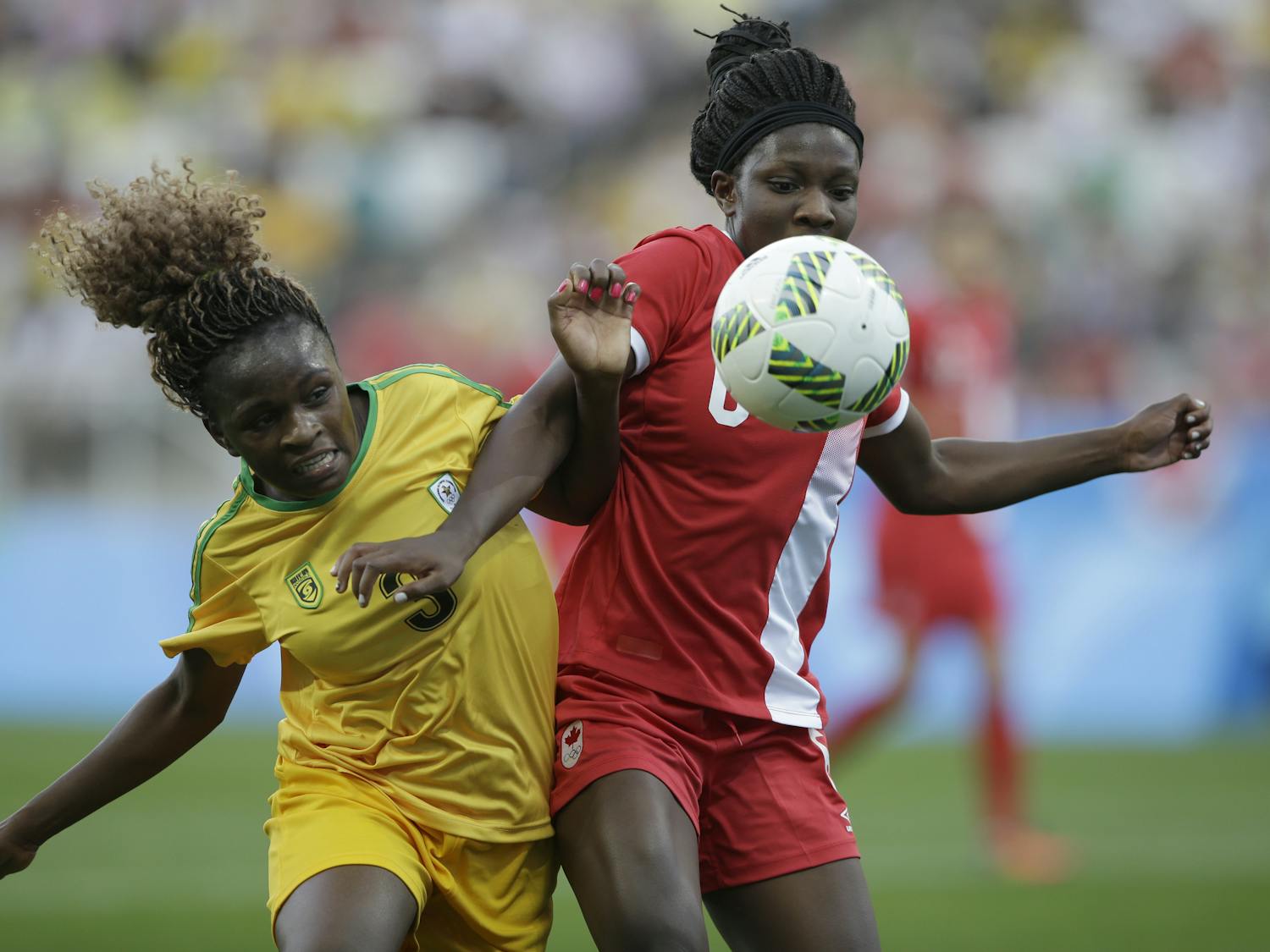 Canada's Deanne Rose, right, and Zimbabwe's Sheila Makoto fight for the ball during a group F match of the women's Olympic football tournament between Canada and Zimbabwe in Sao Paulo, Brazil, Saturday, Aug. 6, 2016. (AP Photo/Nelson Antoine)