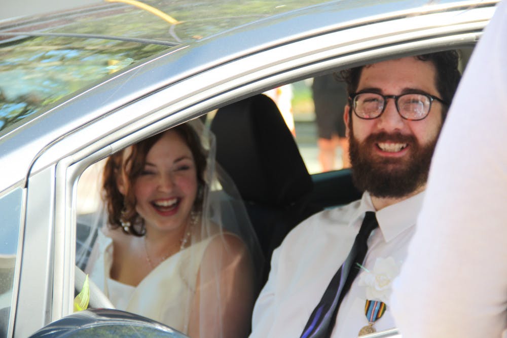 <p>Alix Mathia and Bill Knowles, who were supposed to get married in December, eagerly await in line at the drive-thru-turned-“Wedding Window” at the Clerk of the Court’s office Wednesday evening.</p><p dir="ltr"><span> </span></p>