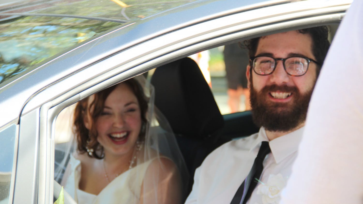Alix Mathia and Bill Knowles, who were supposed to get married in December, eagerly await in line at the drive-thru-turned-“Wedding Window” at the Clerk of the Court’s office Wednesday evening.