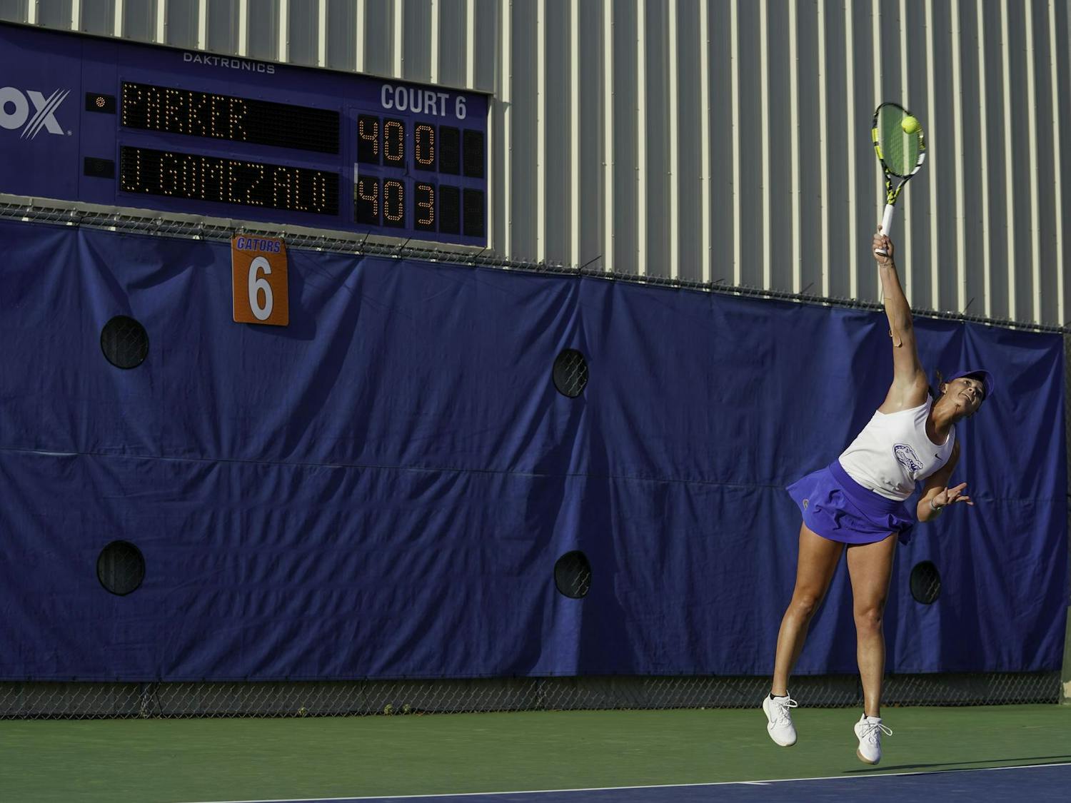 Reagan Parker whacks the ball at her University of Arkansas opponent at Alfred A. Ring Tennis Complex on Friday, March 30, 2025.