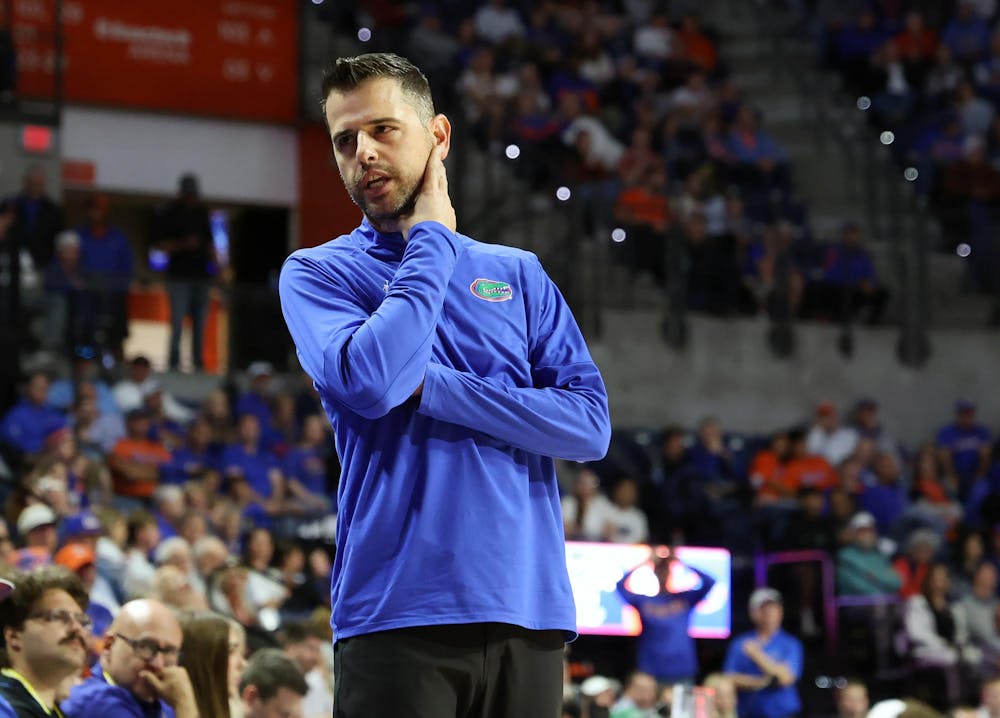 Florida head coach Todd Golden talks with a player as they come off the court during Florida’s game against Dartmouth at the O’Connell Center on Monday, Dec. 29, 2025.
