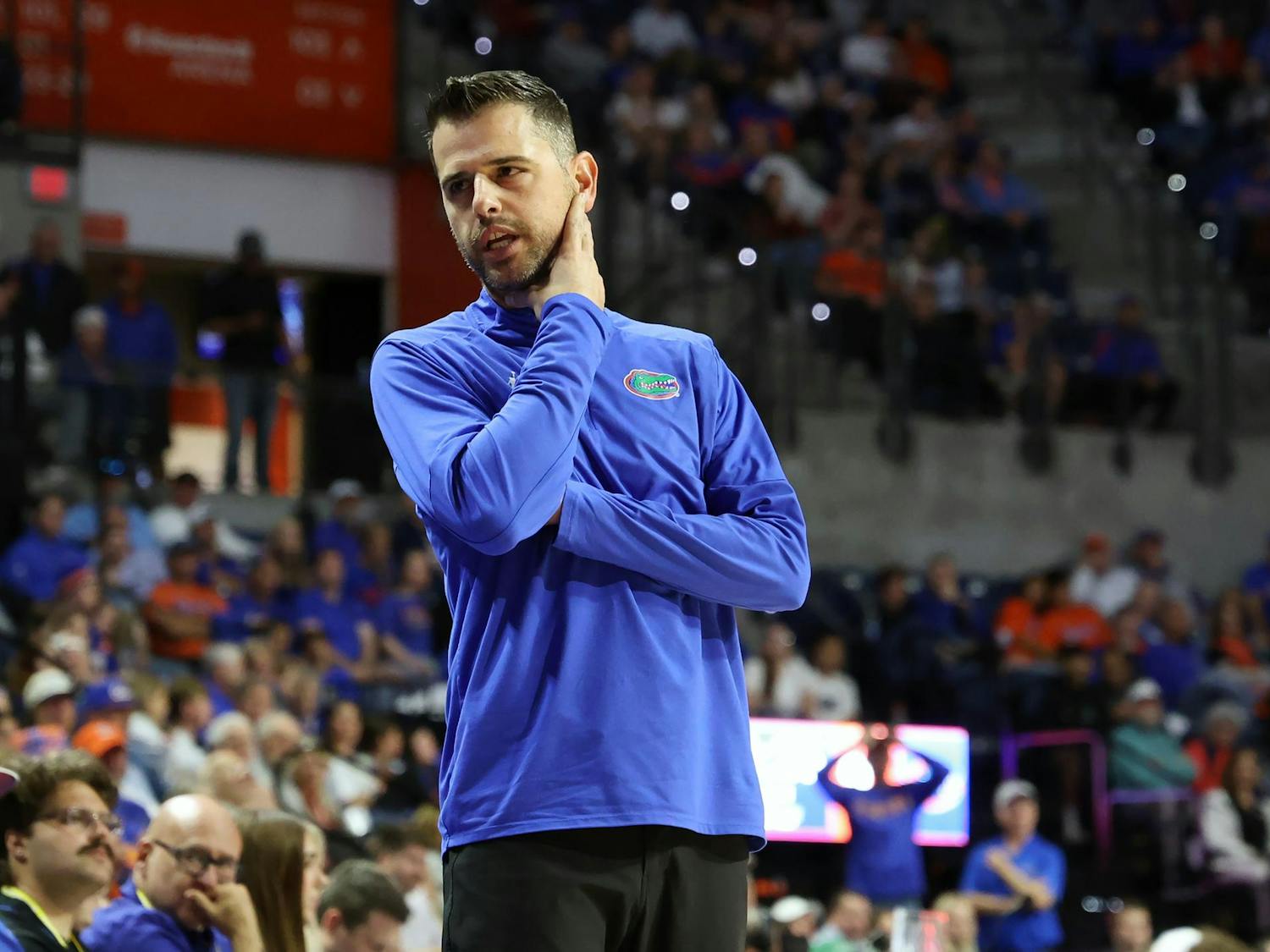 Florida head coach Todd Golden talks with a player as they come off the court during Florida’s game against Dartmouth at the O’Connell Center on Monday, Dec. 29, 2025.