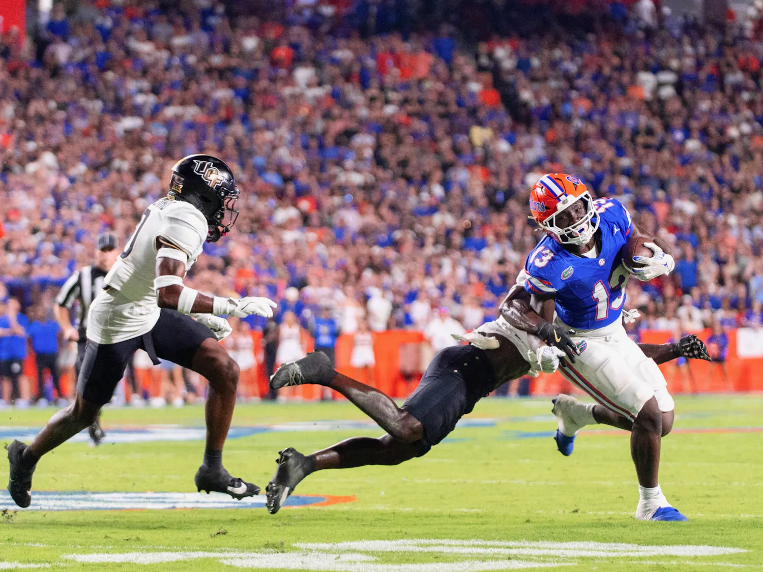 Florida Gators running back Jadan Baugh (13) runs the ball during the first half at Steve Spurrier-Florida Field at Ben Hill Griffin Stadium on Saturday, October 05, 2024.