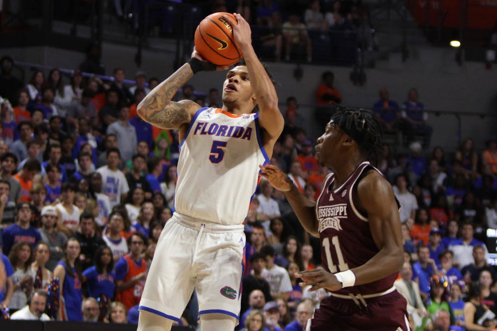 Florida men's basketball guard Will Richard rises up to shoot the ball in the team's win over Mississippi State on Wednesday, January 24, 2024. 