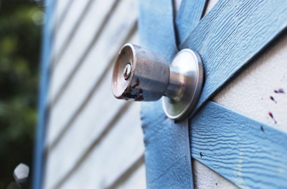 <p>Dried blood remains on the doorknob and shed near where a southeast Gainesville man was shot Tuesday afternoon. Police are still investigating the incident.</p>