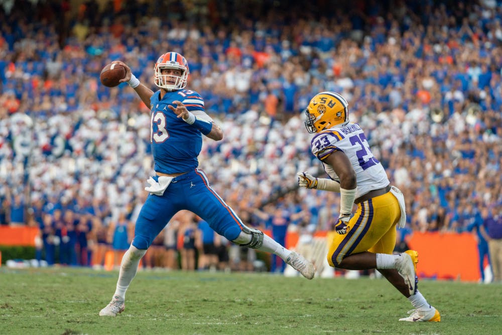 Florida quarterback Feleipe Franks (13) was pressured by LSU defensive players on seven of his nine incompletions in the second half of the Gators’ 27-19 win Saturday. 