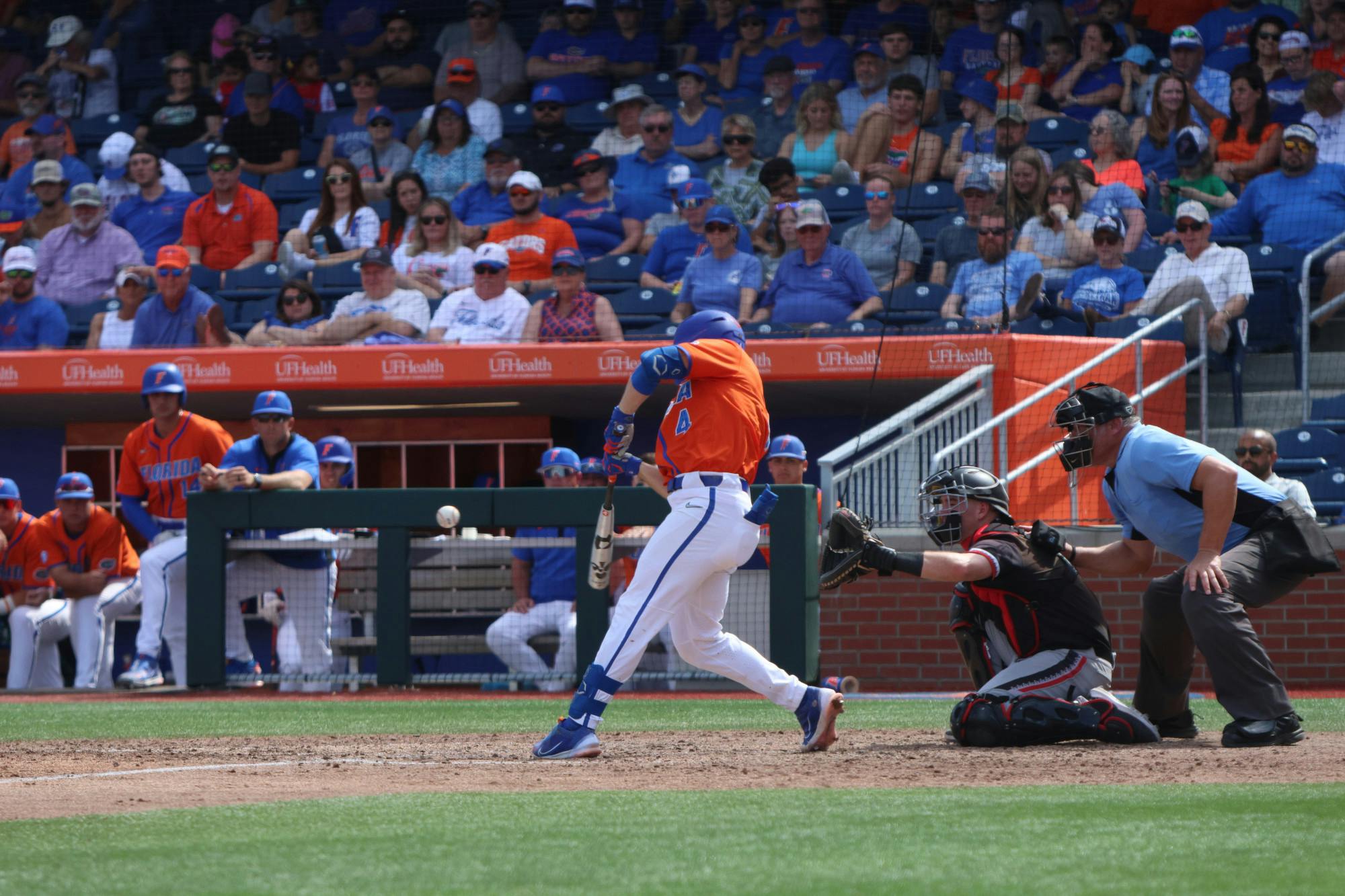 Florida infielder Cade Kurland hits the ball in the Gators' 13-7 win against Cincinnati Bearcats Sunday, Feb. 26, 2023