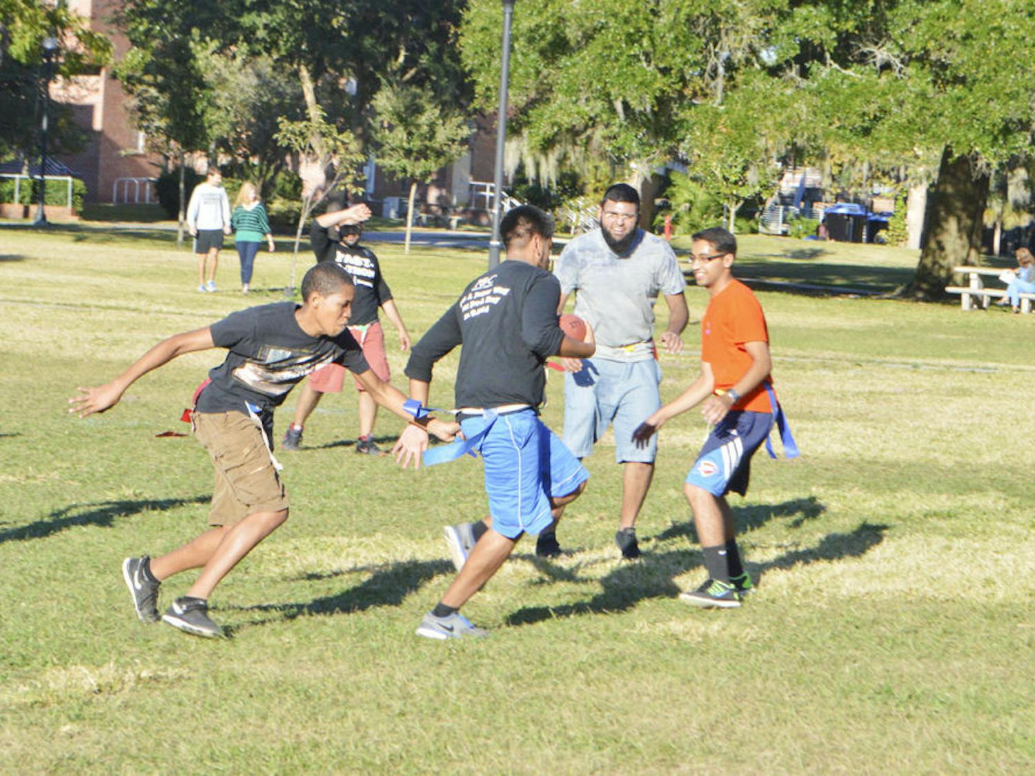 UF students spend their day off Tuesday playing flag football on the North Lawn. Veterans Day gave students the opportunity to relax in the middle of the week.