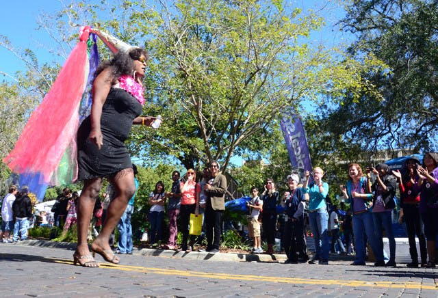 Connell Howell, known as Champagne, struts down Southeast First Street during the Gainesville Pride Parade on Saturday.