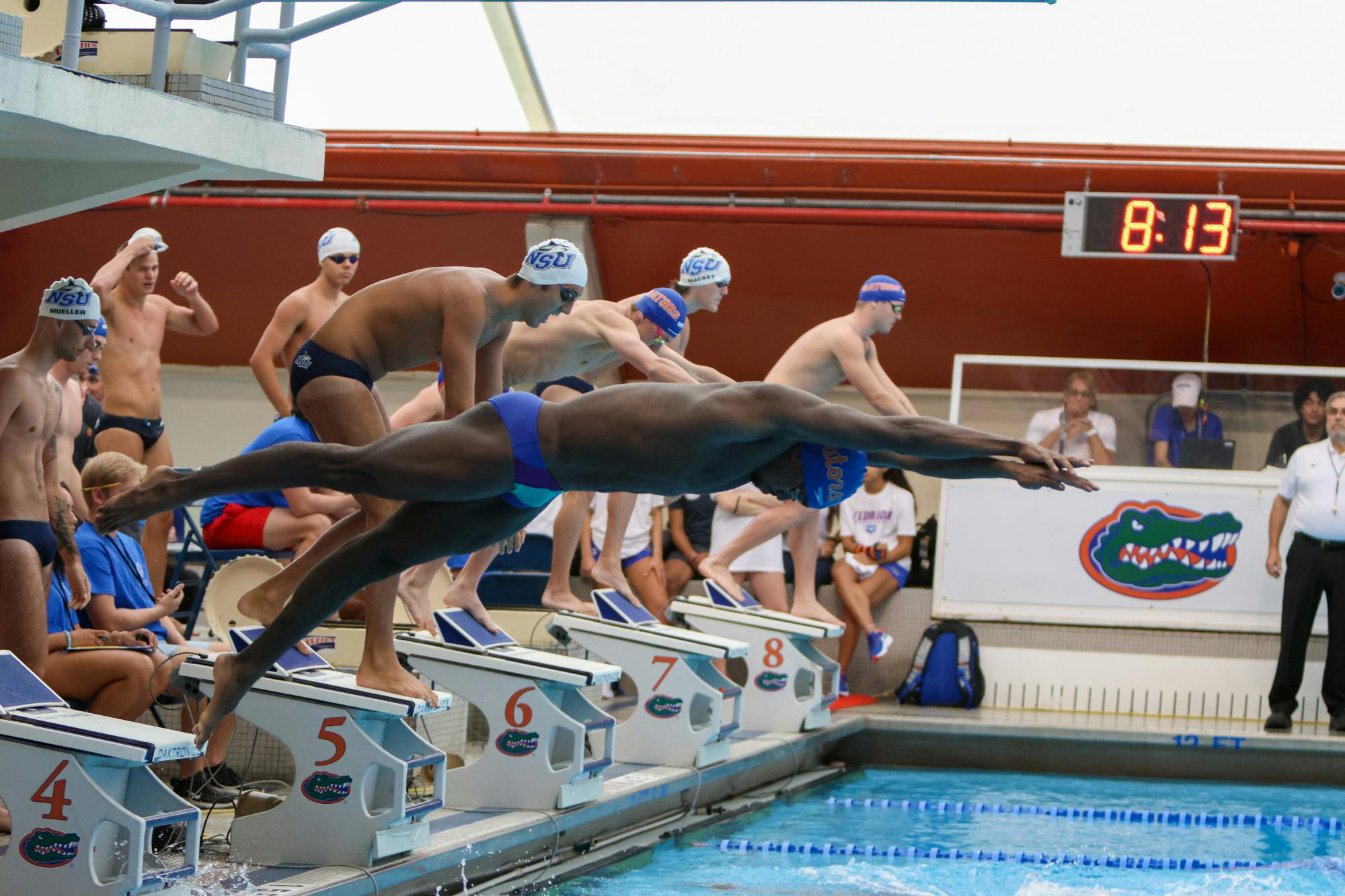 A UF swimmer dives into the pool during a meet between the Gators and Nova Southeastern Friday, Sept. 23, 2022. 